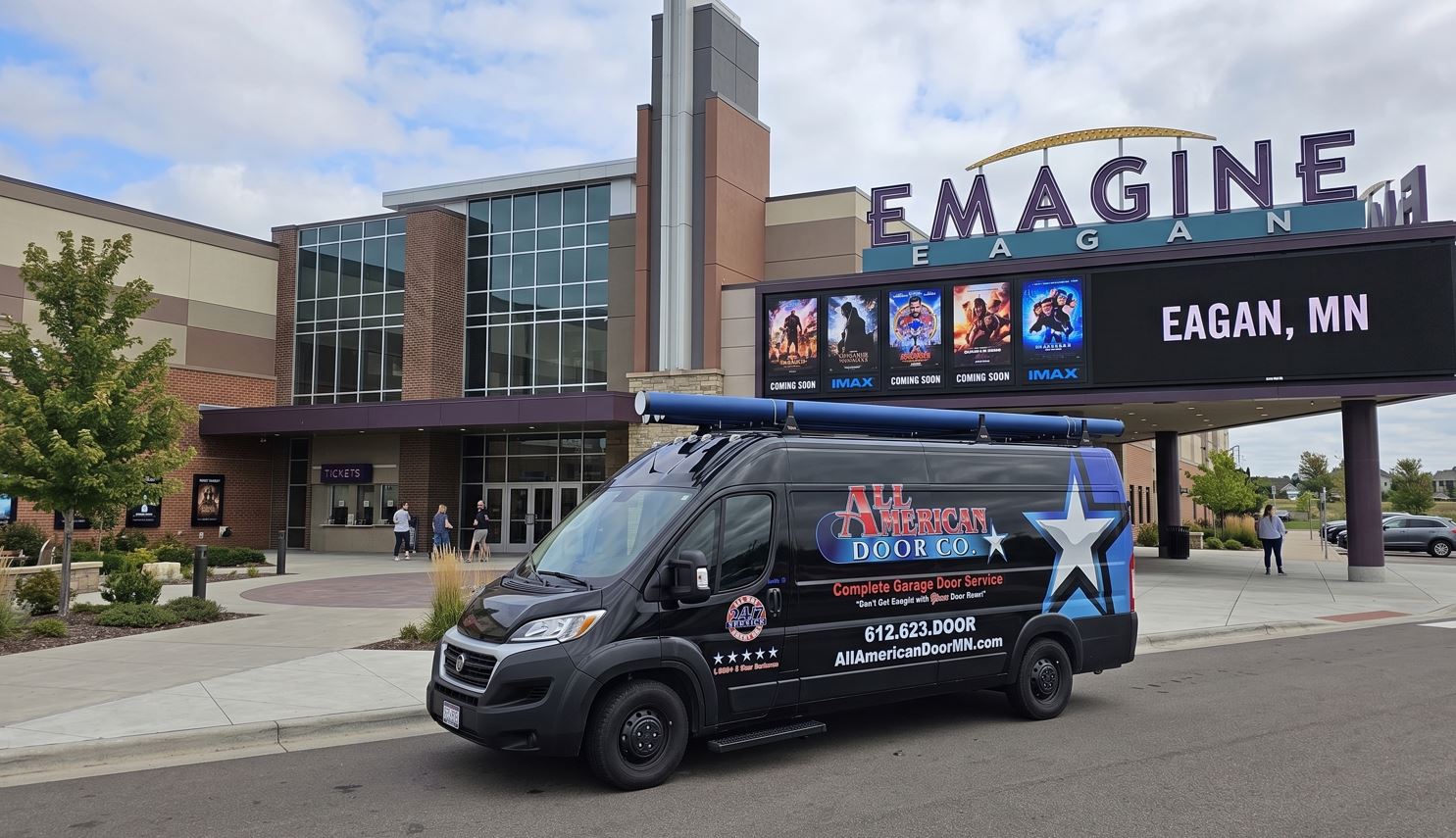 All American Door truck parked in front of Emagine Theatre in Eagan MN