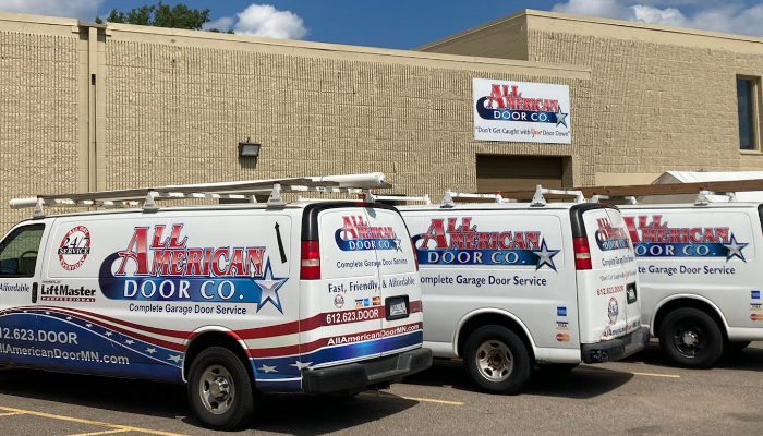 Garage door company vans in front of Minneapolis office
