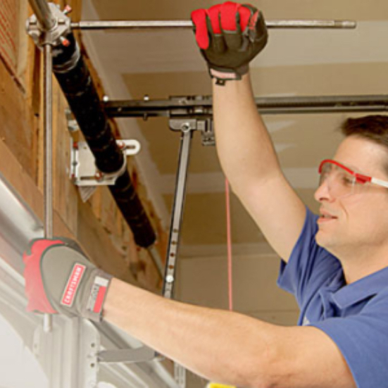 service-tech-working-on-garage-door